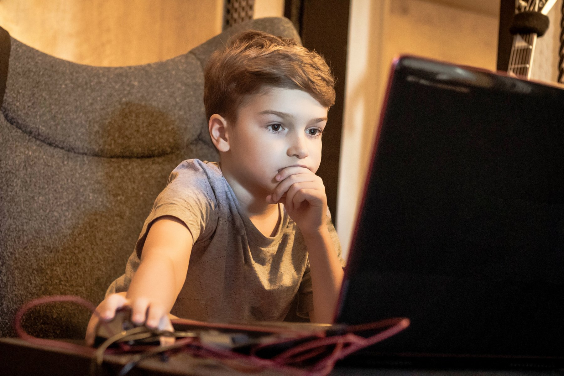 Kid Attending Online Classes on a Laptop